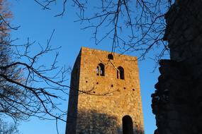 tower with brick walls against the blue sky