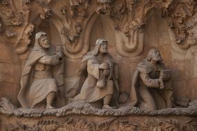 stone statues on the cathedral in barcelona close up