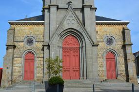 Church Facade with red doors in Brittany