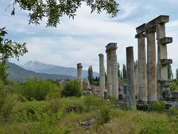 pillars on the ruins of an ancient temple on the mountain