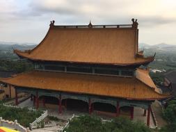 Beautiful Buddha temple, among the green plants and mountains, on the landscape