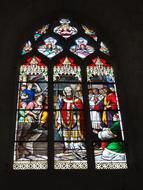 colorful stained glass window in a basilica in france