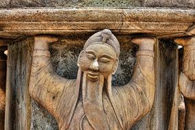 Monk Carrier wood statue