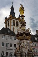 Beautiful fountain of the Gangolf Church in Trier, Germany