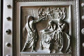 Carved door on the Madeleine Church in Paris, France, in light