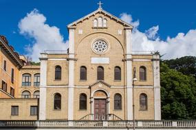 Beautiful landscape with the Saint-Vincent-De-Paul church, near the colorful plants, in Rome, Italy