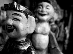 black and white, figurines in a temple in Hanoi, Vietnam