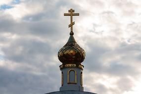 golden cross on the dome of an Orthodox cathedral
