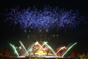 Beautiful Phra Dhammakaya with the colorful lights, under the colorful fireworks, in Thailand, at the night