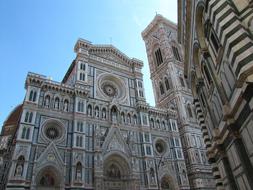 Beautiful church with patterns, in Florence, Italy, under the blue sky