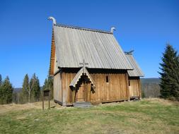 old wooden church against blue sky in Sweden