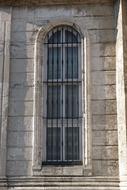 Window of the beautiful, old, stone church in sunlight
