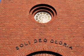 soli deo gloria, latin inscription over entrance to Church