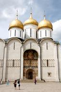 tourists near the orthodox church with golden domes in Moscow