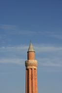 top of brick Minaret of Yivliminare Mosque at sky, turkey, anralya