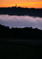 Beautiful landscape of Ammersee and Andechs Monastery in fog, at colorful and beautiful sunrise