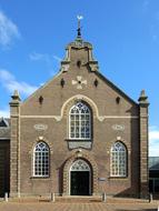 Beautiful church with the steeple in Holland, Netherlands, in sunlight