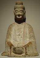 Beautiful, stone figure of Buddha in light