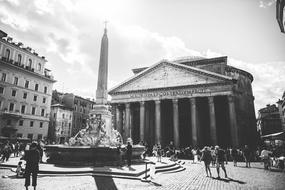 people in the city square in black and white background