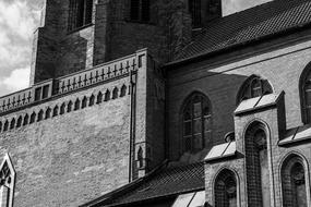 facade of a stone church in black and white background