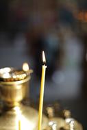 Burning Candle on Church candlelight at blur background