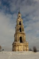 church bell tower in winter landscape