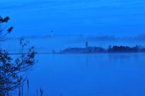 monastery on the river at blue twilight