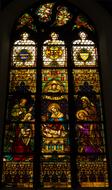 Beautiful and colorful, patterned stained glass windows in the Mons church