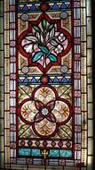 Colorful and beautiful stained glass window in the church, with patterns and ornaments