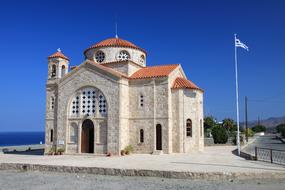 flag near the church in greece