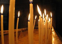 burning candles in the church during the ceremony