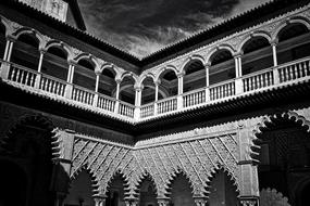 black and white photo of a temple building with arches