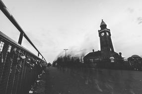 Beautiful, black and white landscape with the fence with padlocks, near the church