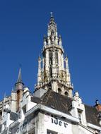 Beautiful and colorful tower of the church in sunlight, in Antwerp, Belgium, under the blue sky