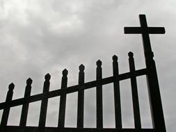 Church gate with Cross at clouds