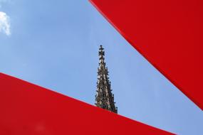 Tower in Ulmer, Germany, under the blue sky with white clouds, among the red frames, clipart