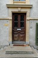 closed entrance Door of church, switzerland, romaimoutier