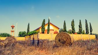 Beautiful and colorful landscape with plants and church with cross, in Ayia Anna, Cyprus