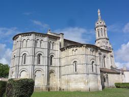 church with a tower with a historic facade against the blue sky