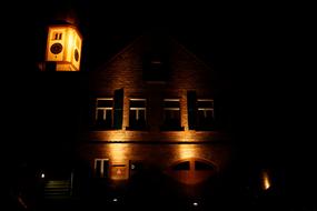 lighting a stone church at night