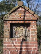 brick memorial with a cross