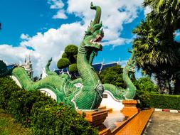 Beautiful landscape of the Temple Complex with green dragons and colorful plants, in the North Thailand