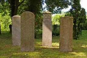 old sandstone Gravestones on Cemetery at summer