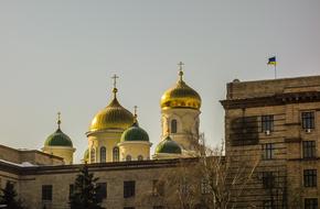 church with domes outside the city building