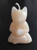 figurine of a cat in a meditation pose