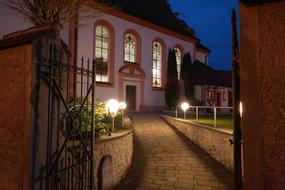 Beautiful St Franziskus church with lights, in the evening