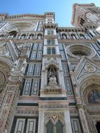 Beautiful and colorful church with patterns, in Florence, Italy, under the blue sky