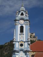 Beautiful and colorful church in Wachau, Austria, under the blue sky with clouds