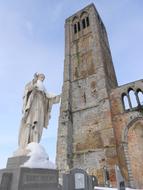 Beautiful and colorful church and statue, under the blue sky
