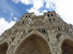 historic cathedral under the sky with clouds in france